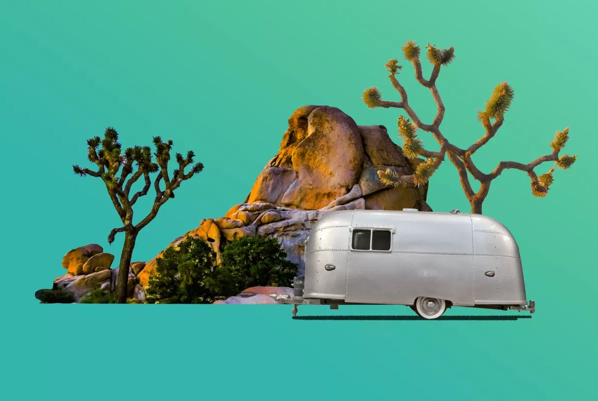 This meme is a humorous image of a 1976 Airstream trailer, a classic recreational vehicle, parked in front of a large rock formation in Joshua Tree National Park. The image is captioned "when you finally find a spot with good cell service".